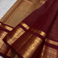 Warm arakku red Kanchipuram zari kattam saree, showing body, border and detailed gold zari pallu
