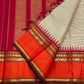 Traditional Korvai join and orange Rettapet border on a biscuit beige Kanchipuram silk saree