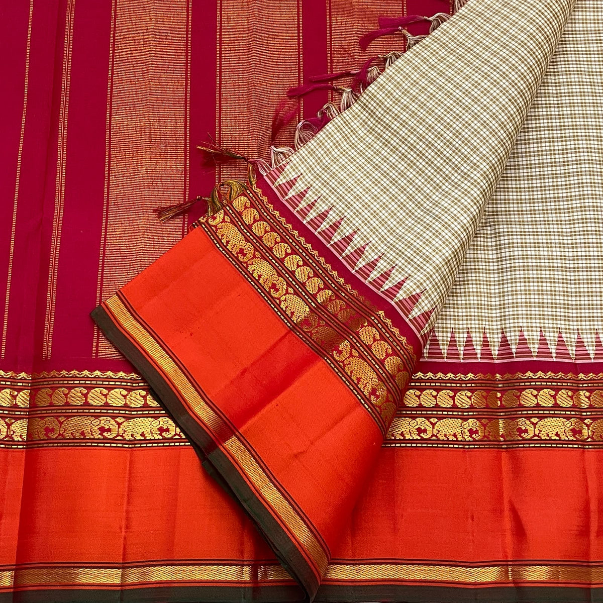 Traditional Korvai join and orange Rettapet border on a biscuit beige Kanchipuram silk saree