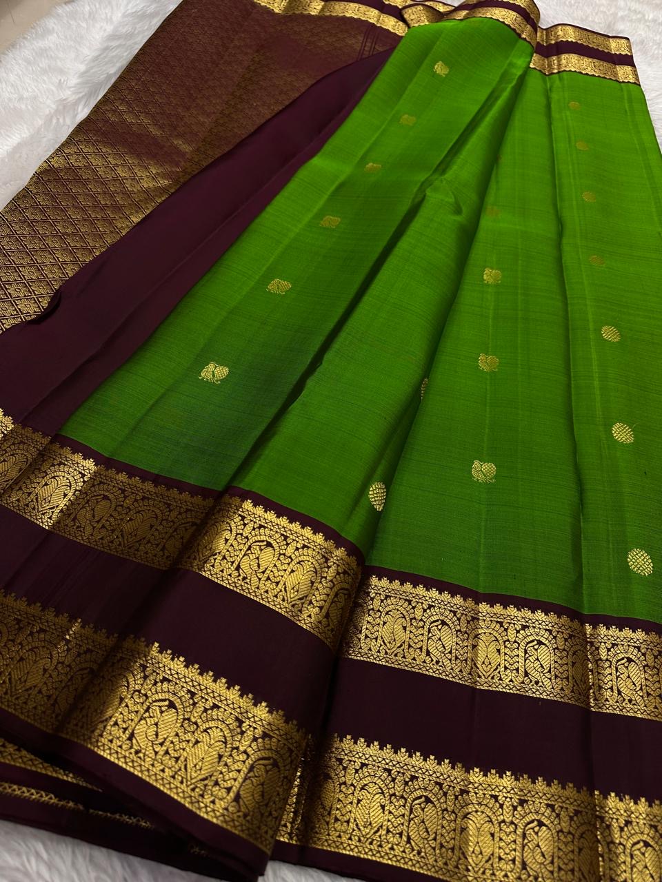 Traditional parrot green Kancheepuram silk saree with deep coffee brown rettapet border Idam Living