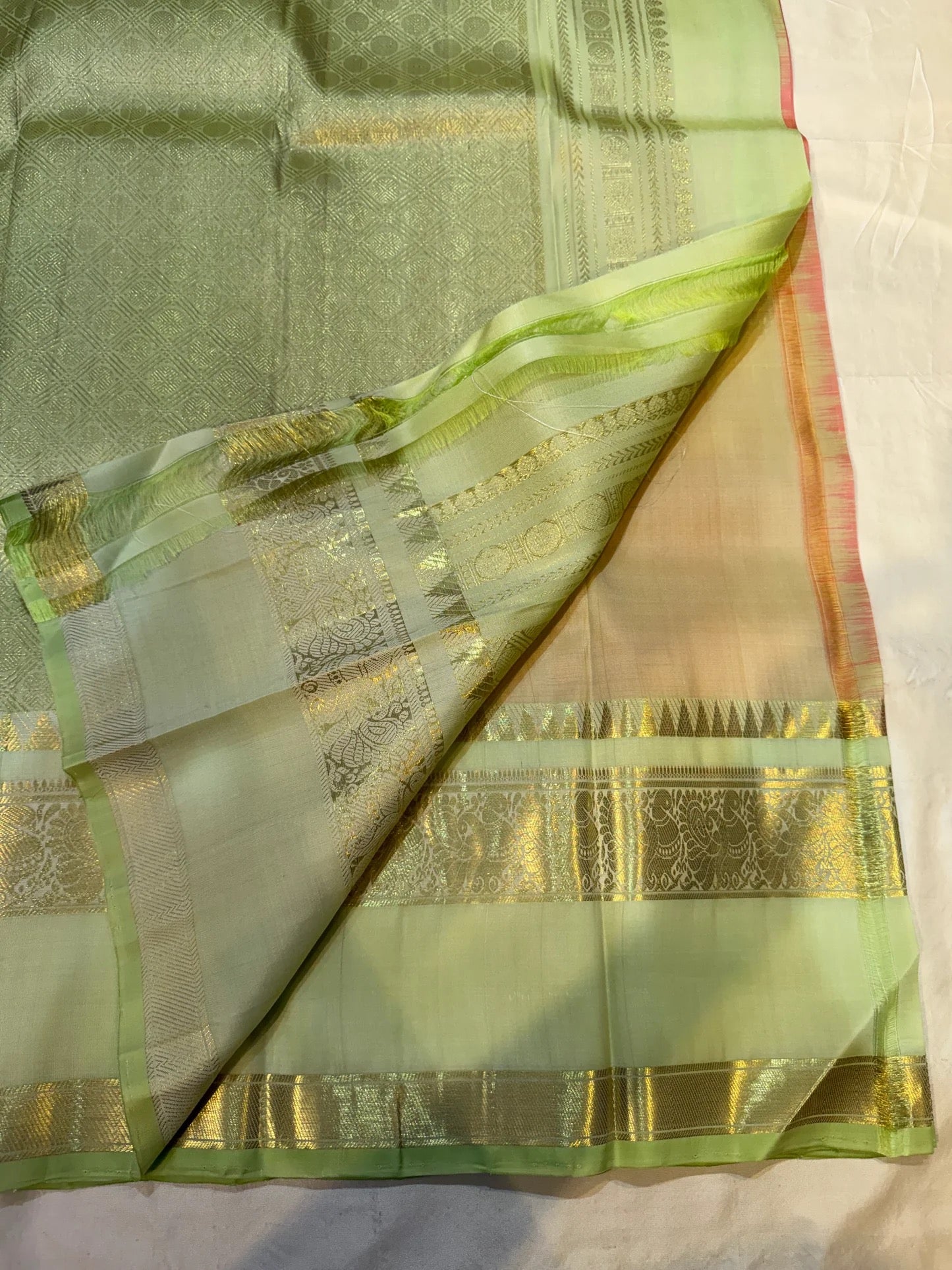 Gold zari floral butta detail on golden peach pure silk Kancheepuram saree body — Idam Living