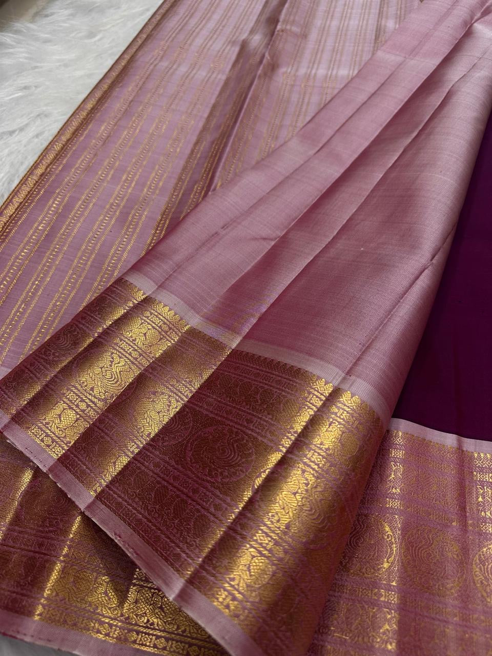 Traditional peacock and lotus motif on KanchiPattu silk saree border
