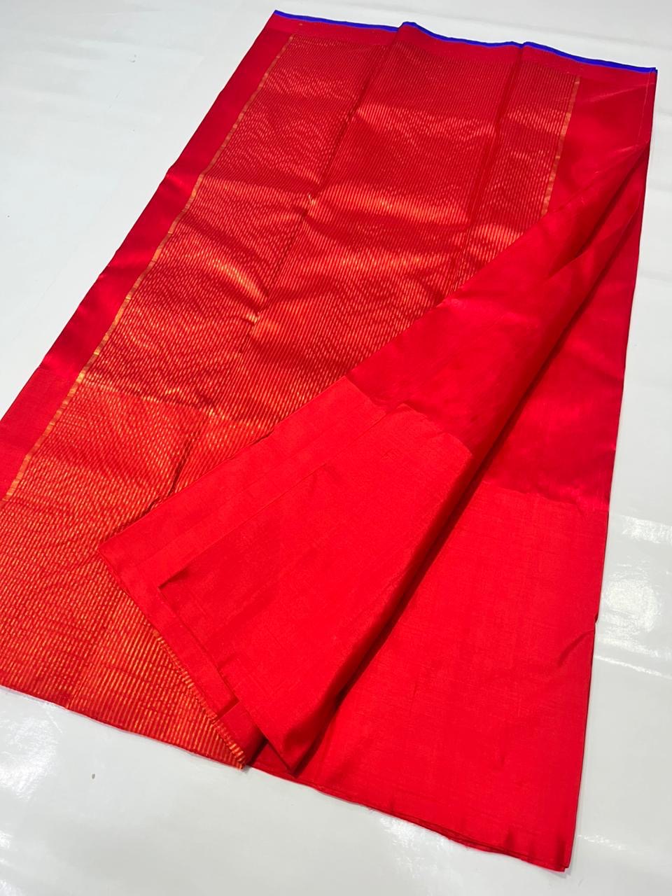 Luminous ruby red Chanderi silk saree with elegant violet border detailing