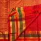 Radiant vermilion red reminiscent of temple kumkum pure silk Kanchipuram saree, yaanai elephant zari butta detail; traditional Zari Kattam weave.