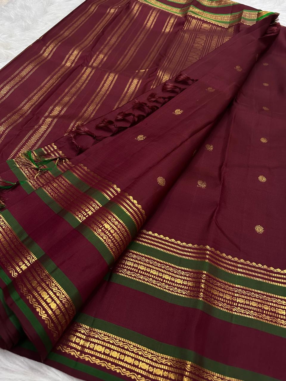 Pallu detail of Deep Raspberry Red Kanchi Pattu silk saree showing zari craftsmanship