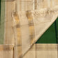 Double-shot leaf-to-emerald green with golden-mustard light pure silk Kanchipuram saree, vintage rettapet double border detail; traditional Rettapet weave.