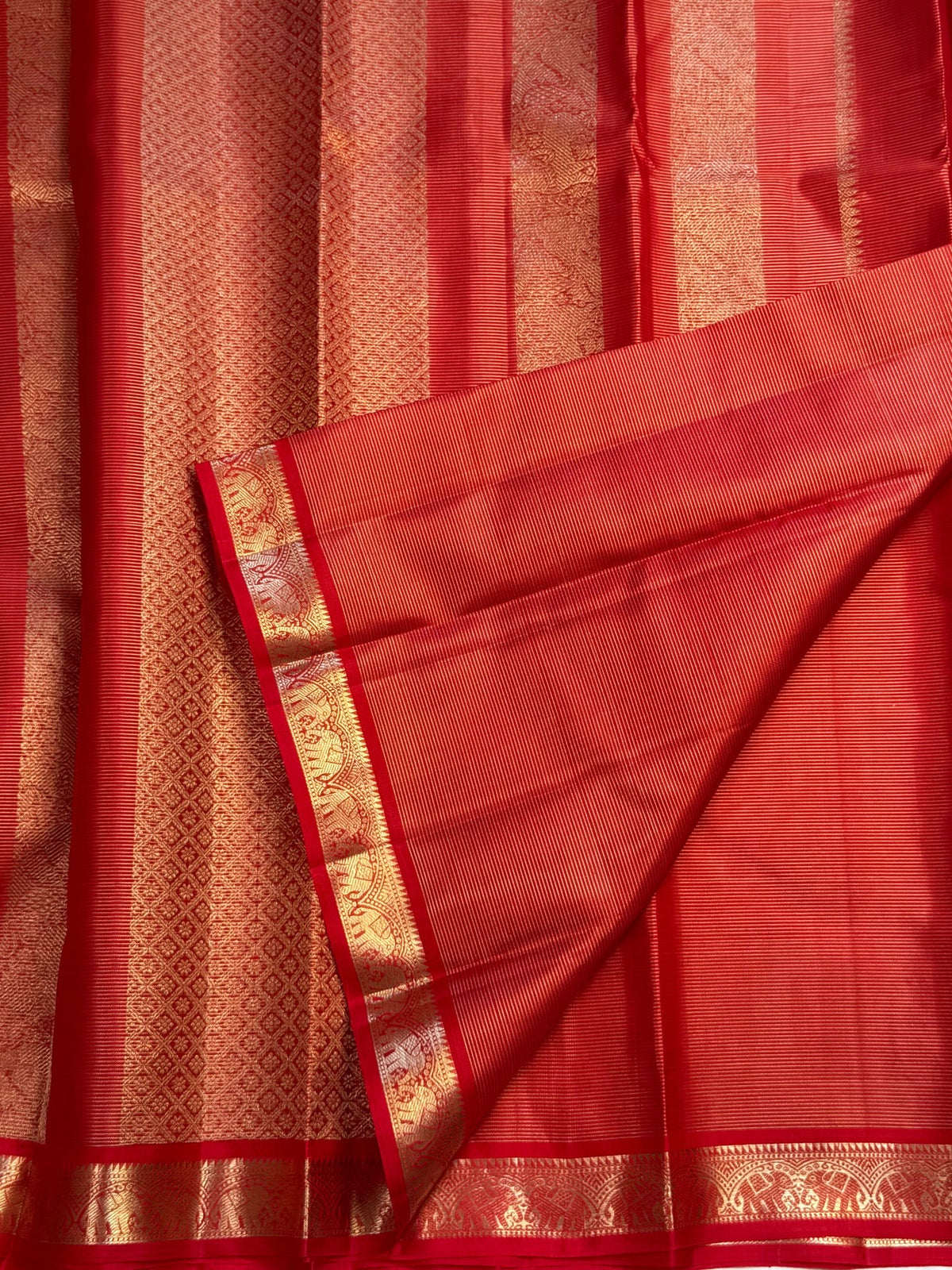 Fine parallel Vairaoosi stripes visible in the red silk body beside small paisley zari buttas