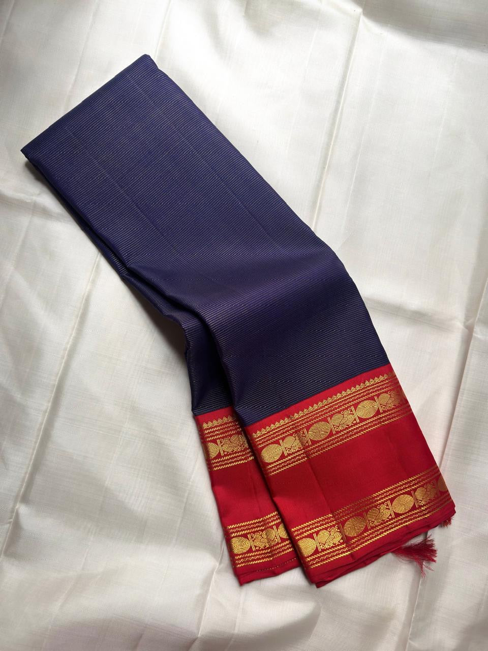 Vermilion red Rettapet border detail on deep navy Vairaoosi KanchiPattu silk saree