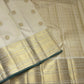 Warm ivory pure silk Kanchipuram saree showing fine gold zari kattam checks and petite Kili bird motifs