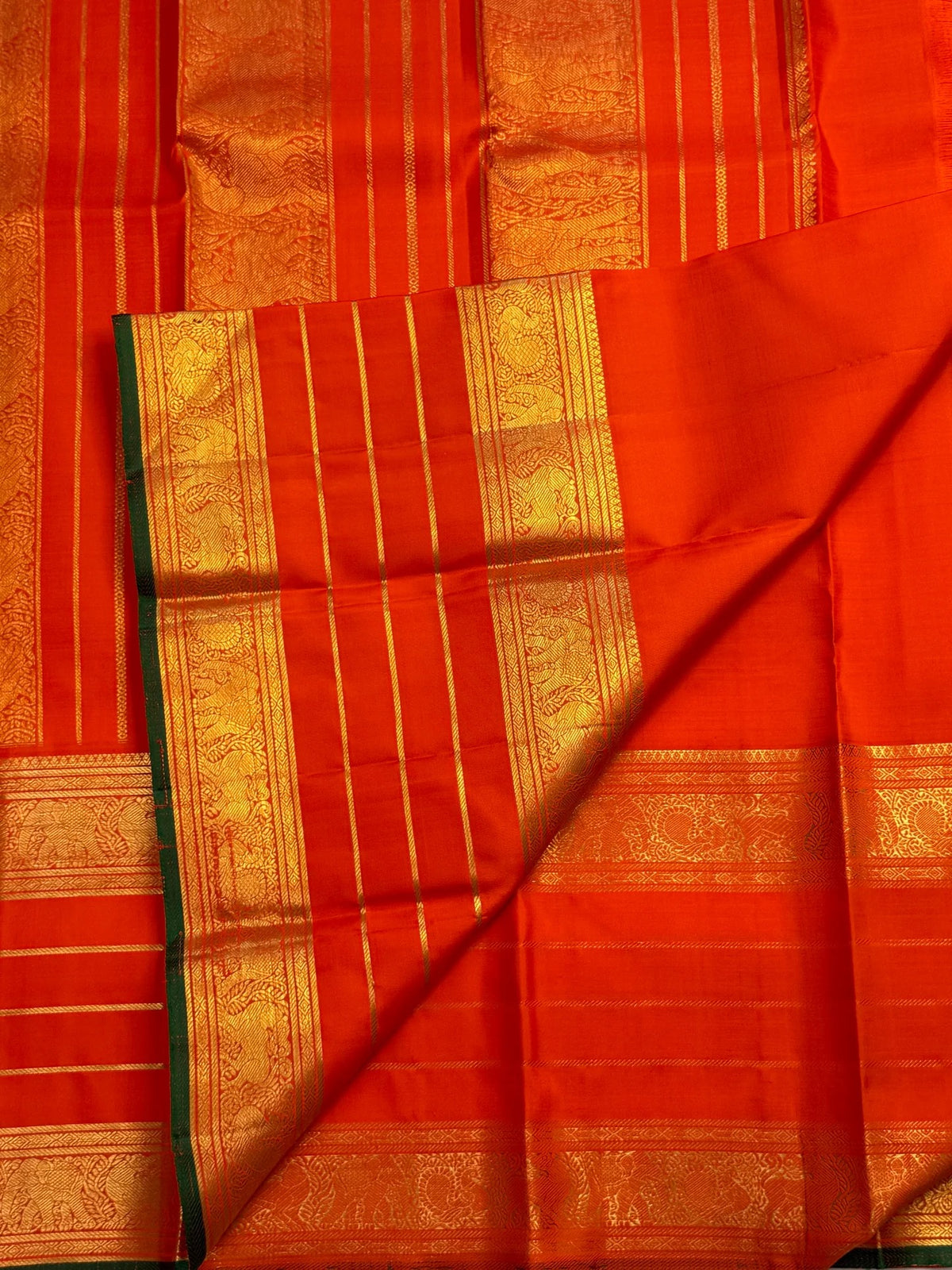 Traditional Yazhi motif detailing on a handwoven orange Pure Silk Kanchipuram Varisaipet saree.