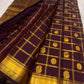 Traditional Zari Kattam Kanchipuram saree in deep aubergine with Mayil Chakram motifs, styled view