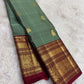 Traditional zari Korvai Kanjivaram saree sage green with burgundy red border – close-up weave detail