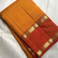Turmeric gold Kanchipuram silk saree draped, showing Rettapet border and pallu