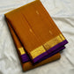 Ponvandu Turmeric Yellow pure silk Kanjivaram Butta saree with antique-gold zari motifs.