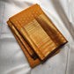 Turmeric Yellow pure silk Kanchipuram saree with antique-gold woven detailing.