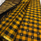 Handwoven Kanchipuram silk saree with classic yellow and black checker pattern