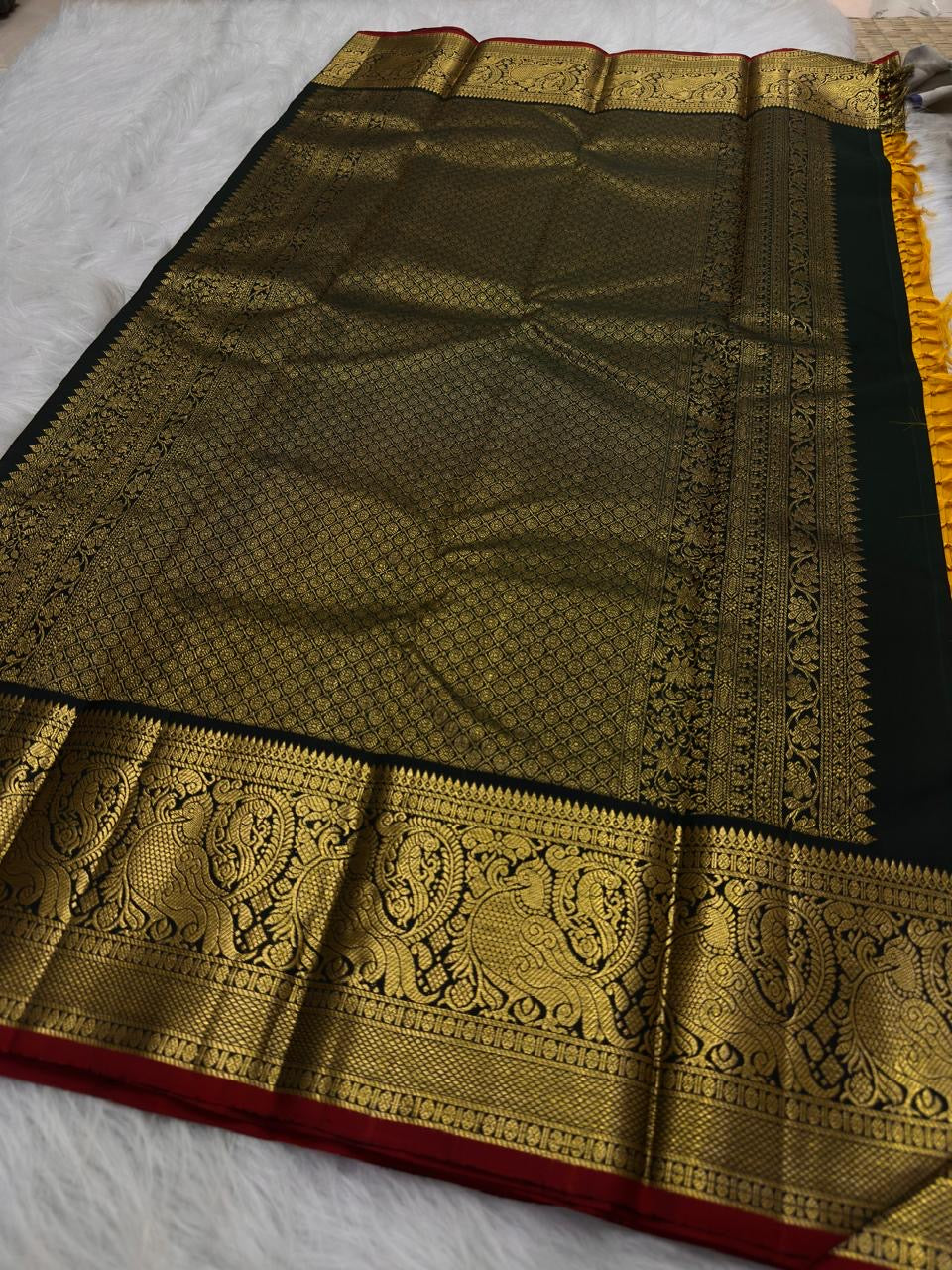 Turmeric Yellow saree with Black Mayil border close-up