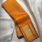 Broad traditional antique-gold border on Turmeric Yellow Kanjivaram saree.