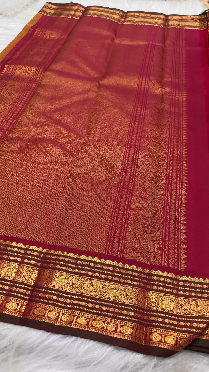 Turmeric Yellow Pure Silk Kanchipuram Korvai saree with petite gold buttas and deep Maroon zari border.