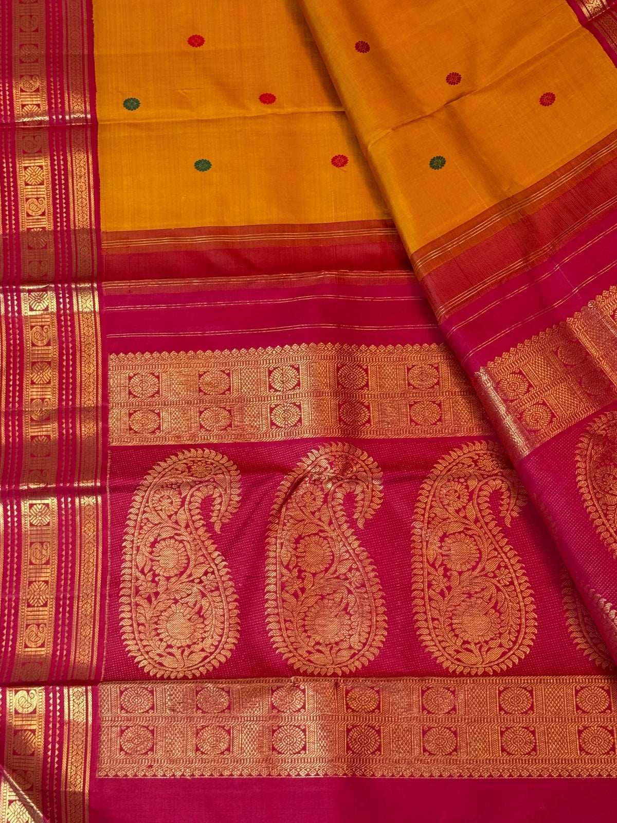Turmeric yellow Kancheepuram Korvai saree with Kumkum red zari