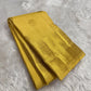 Close view of turmeric yellow Kanchipuram silk with elaborate multi-layer Kamalam zari buttas.