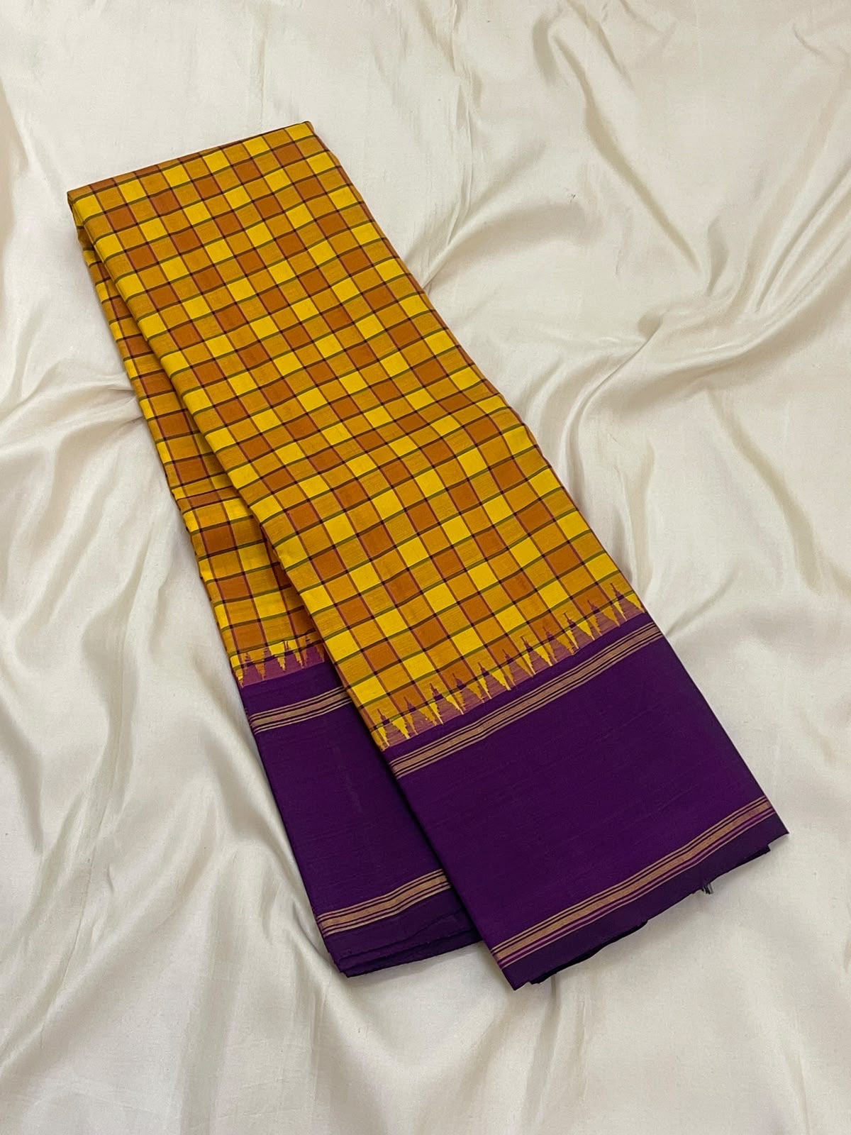 Turmeric Yellow Handwoven Pure Silk Kanchipuram Saree with Kanchi Kattam and Purple Rettapet Border, folded saree presentation
