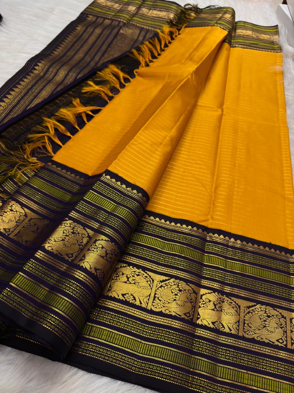 Turmeric yellow Kanjeevaram silk saree body with horizontal zari stripes