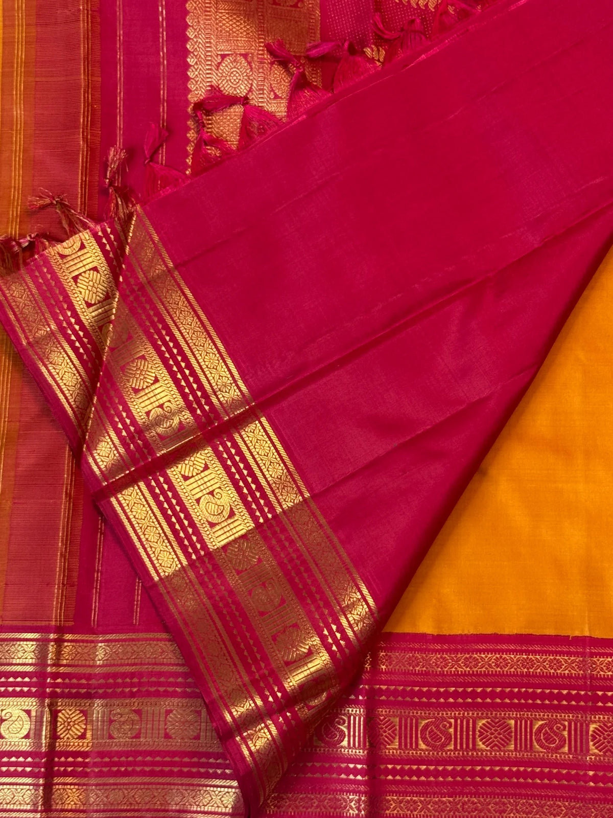 Turmeric yellow Kanjivaram Korvai silk saree with Kumkum red border
