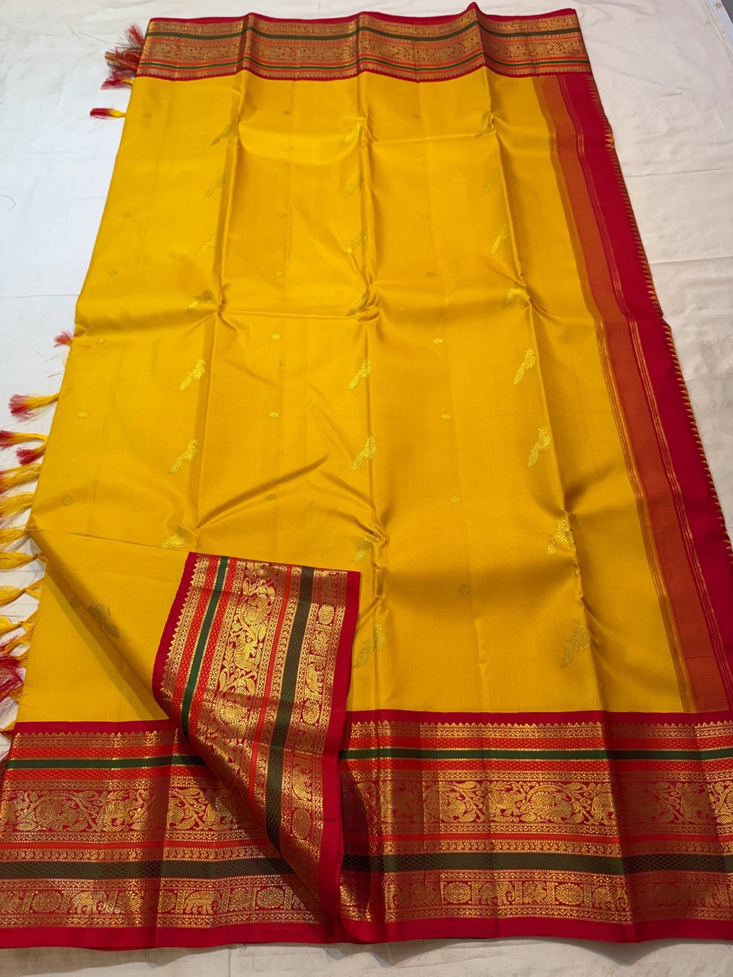 Turmeric Yellow Handwoven Pure Silk Kanjeevaram Saree with Kumkum Red Korvai Zari Border