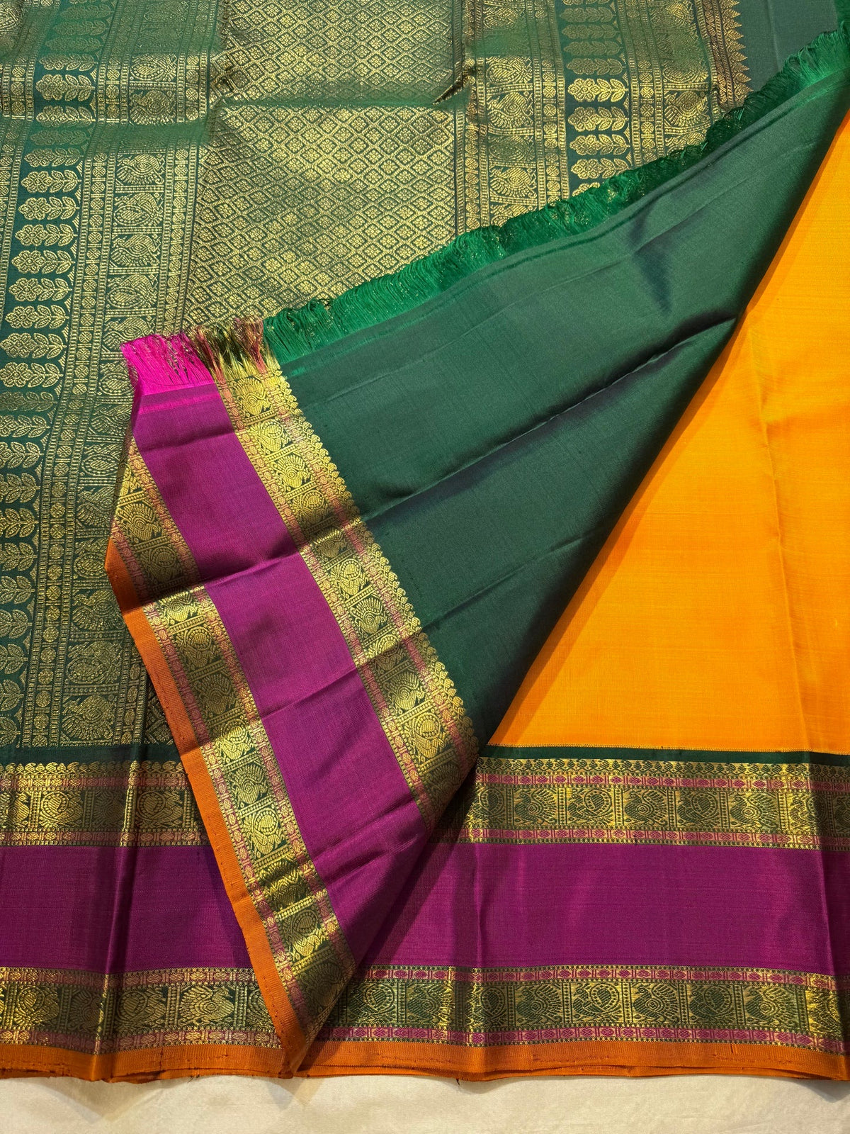 Turmeric Yellow Pure Silk Kanchipuram Rettapet saree with petite zari buttas