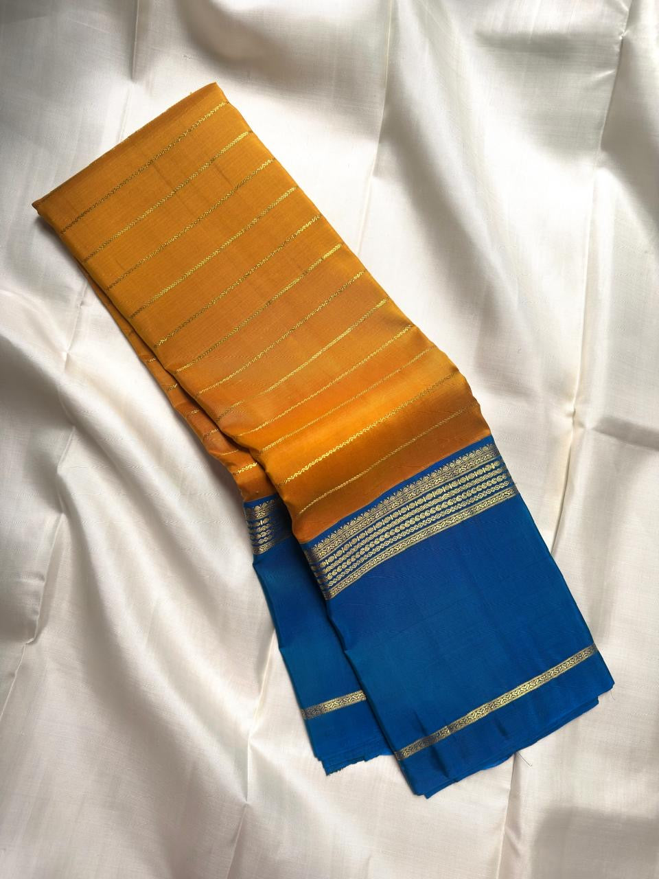 Turmeric Yellow Pure Silk Kanjivaram Rettapet saree with broad Royal Blue border