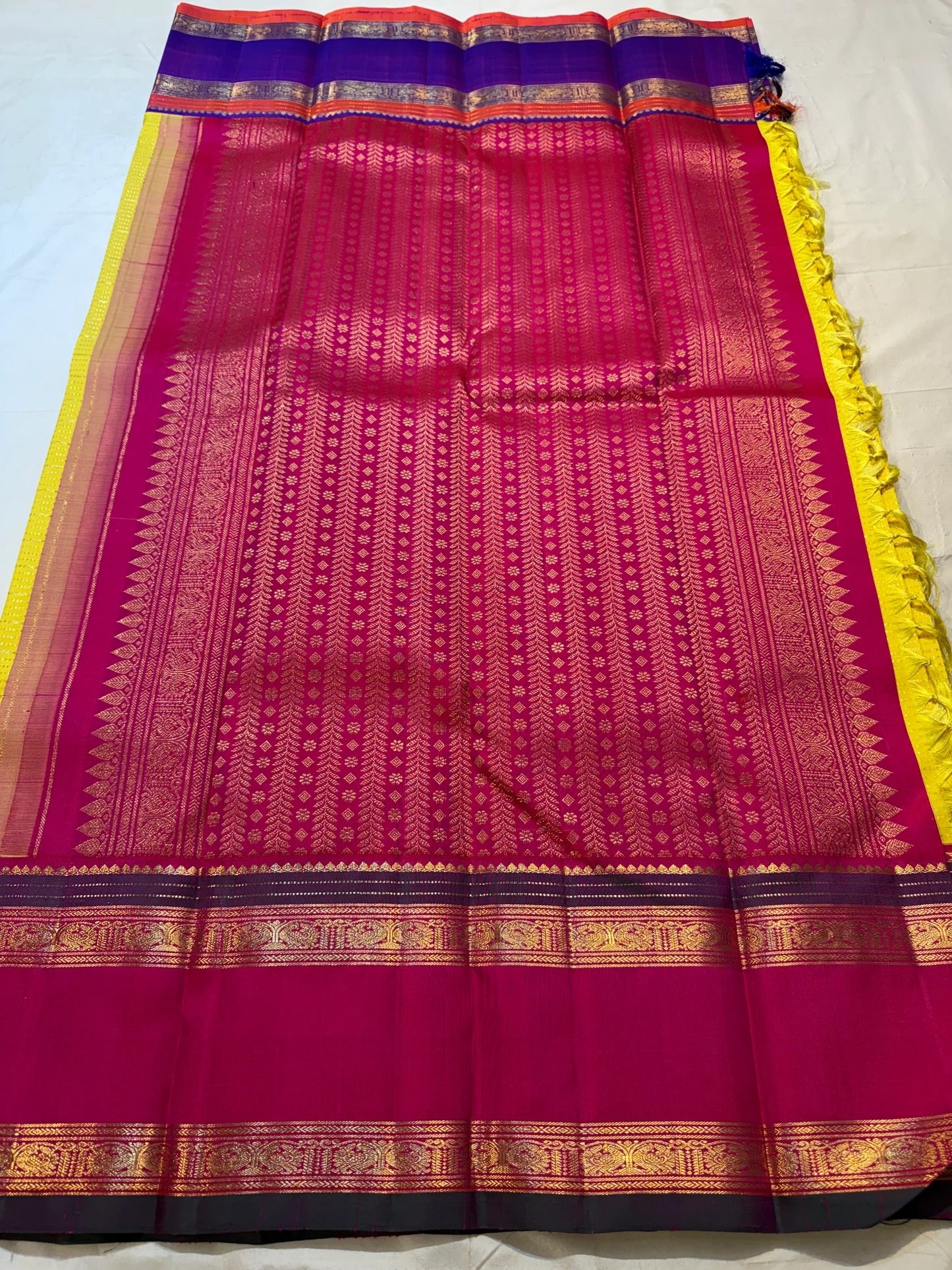 Turmeric Yellow pure mulberry silk saree with Rani Pink Ganga Jamuna border detail.