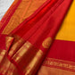Turmeric Yellow and Vermilion Red Kanchipuram Butta saree.