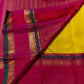 Turmeric Yellow Kanchipuram silk saree with fine antique-gold linear zari detailing.