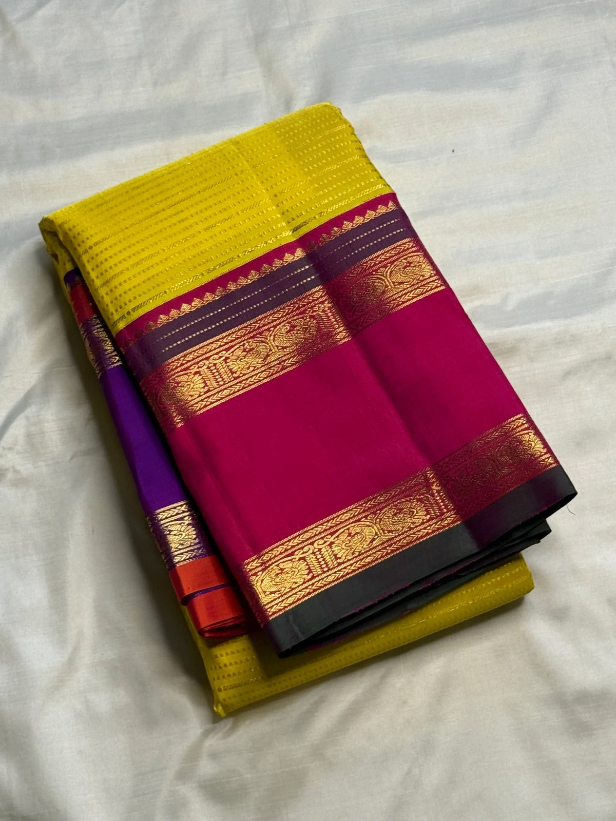 Close view of the Royal Purple Ganga Jamuna border with antique-gold zari.