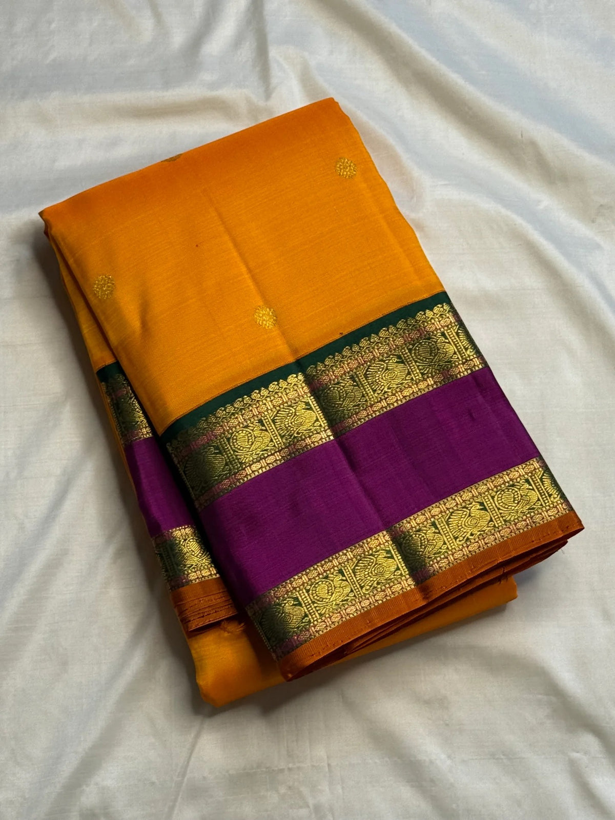 Turmeric Yellow silk saree with Magenta border and gold zari detail