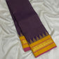 Turmeric Yellow pallu with vertical gold zari registers and a muted olive-antique-gold stripe