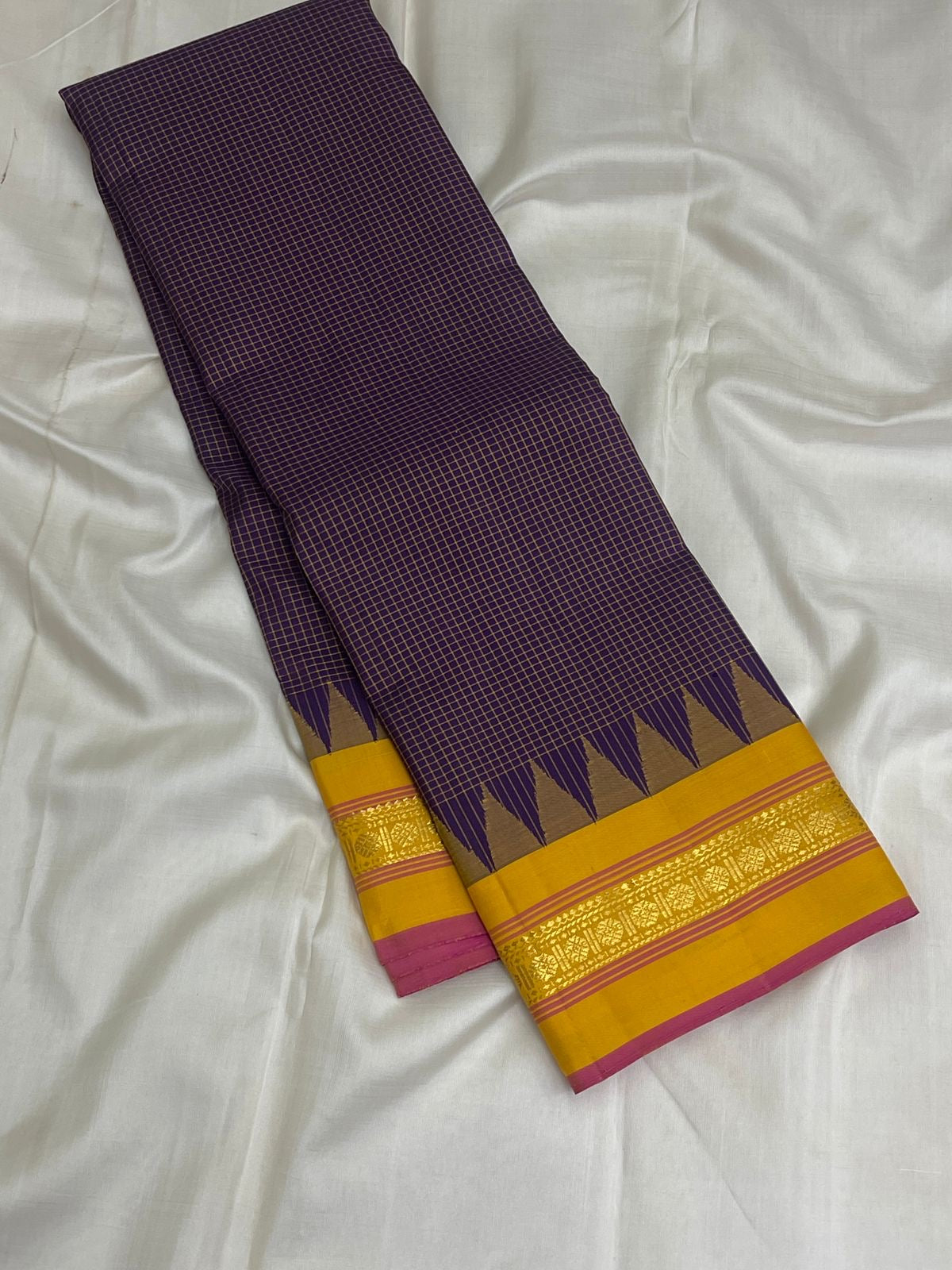Turmeric Yellow pallu with vertical gold zari registers and a muted olive-antique-gold stripe