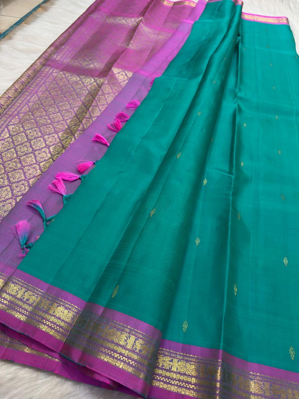 Antique-gold zari buttas individually spaced across Aqua Turquoise Kanjivaram silk.