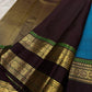 Dense gold zari pallu on the turquoise blue Kancheepuram rettapet saree.