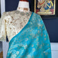 Close view of zari buttas on blue green Pure Katan Silk Banarasi saree