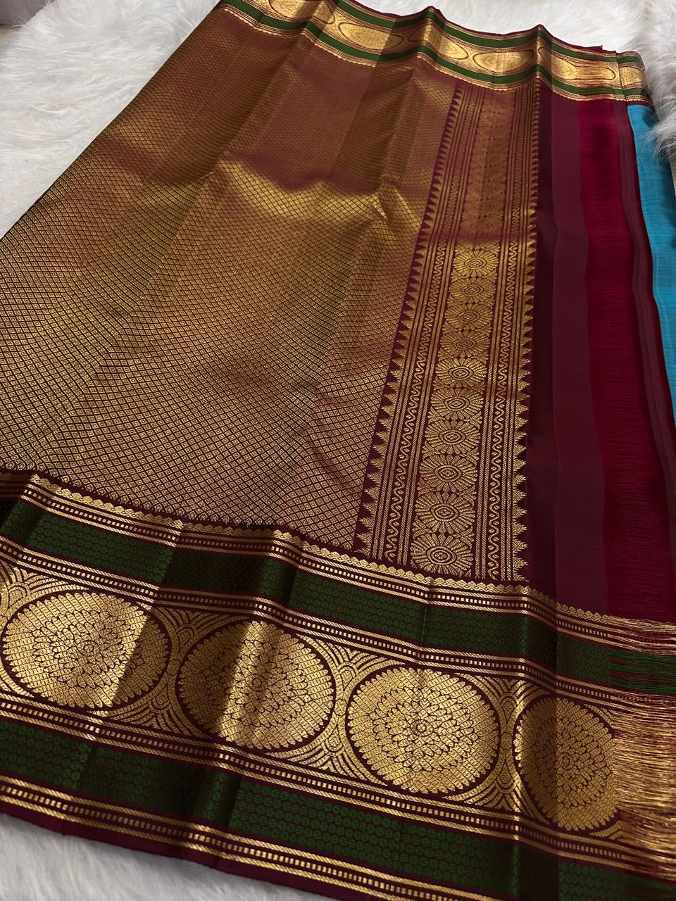 Turquoise Blue Kanchipuram silk saree with petite scattered gold zari buttas