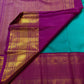 Close view of Deep Purple Kanchipuram Korvai pallu with dense gold zari diamond lattice and Turquoise Blue silk body.