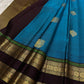 Border detail showing slim green highlight bands and gold zari.