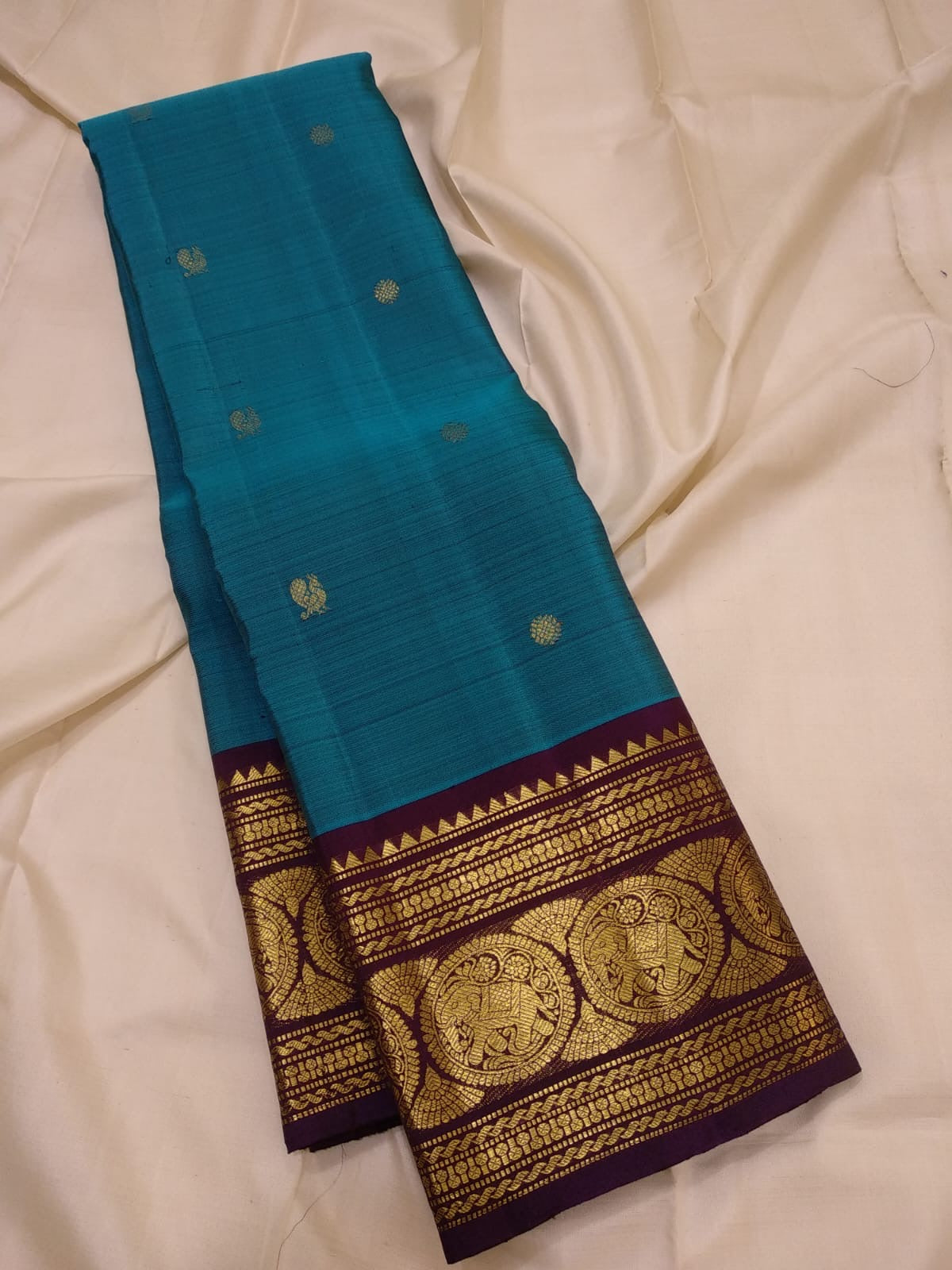 Handwoven Turquoise Blue Kanjivaram saree with Royal Purple contrast