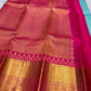 Thazampoo Reku border detail on the turquoise and pink saree.