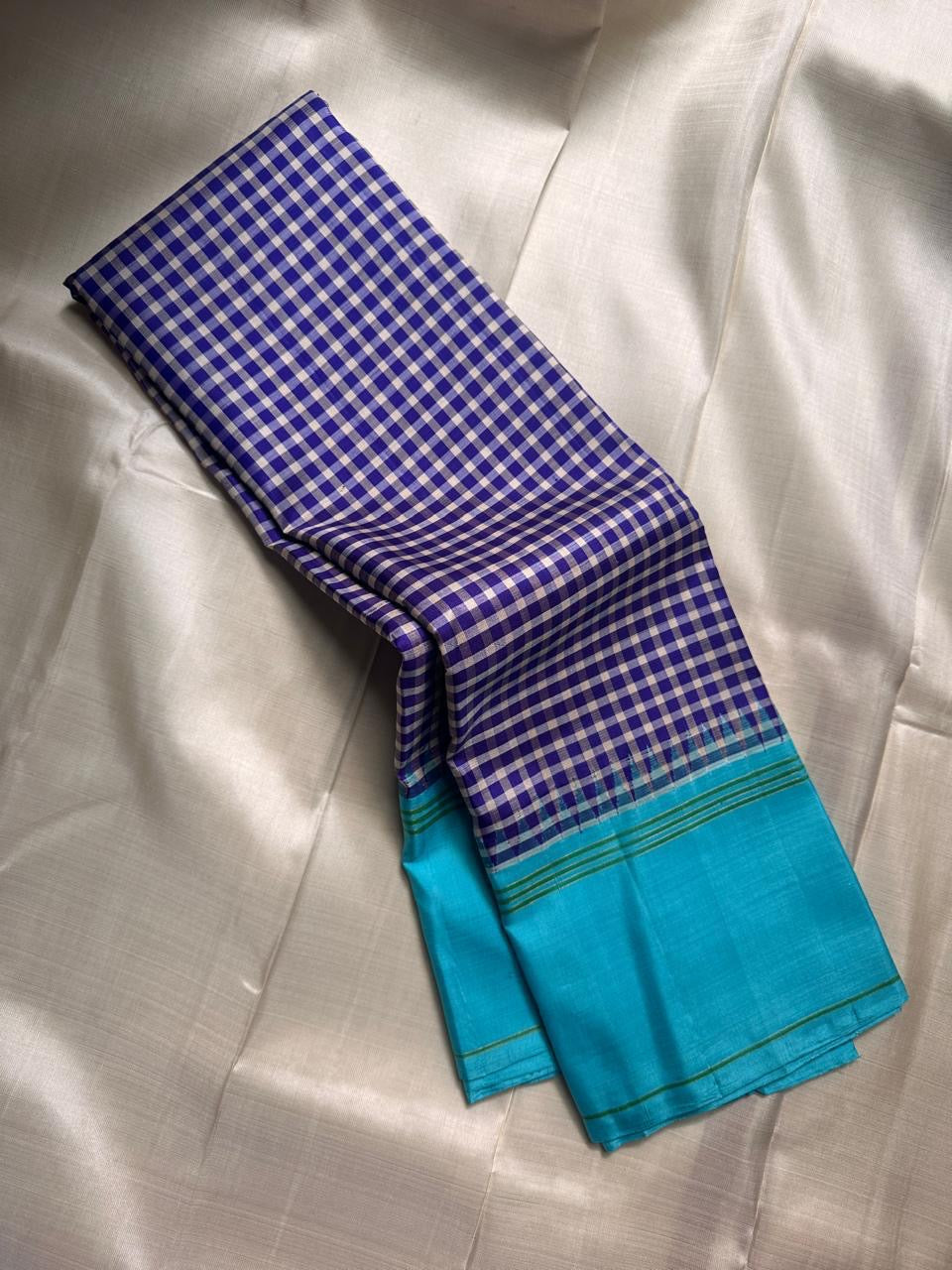Turquoise border of the indigo and ivory check pure silk Kanjivaram saree