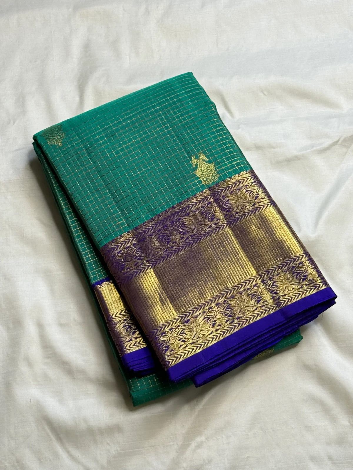 Turquoise green Kanchipuram saree with Gandaberunda zari buttas