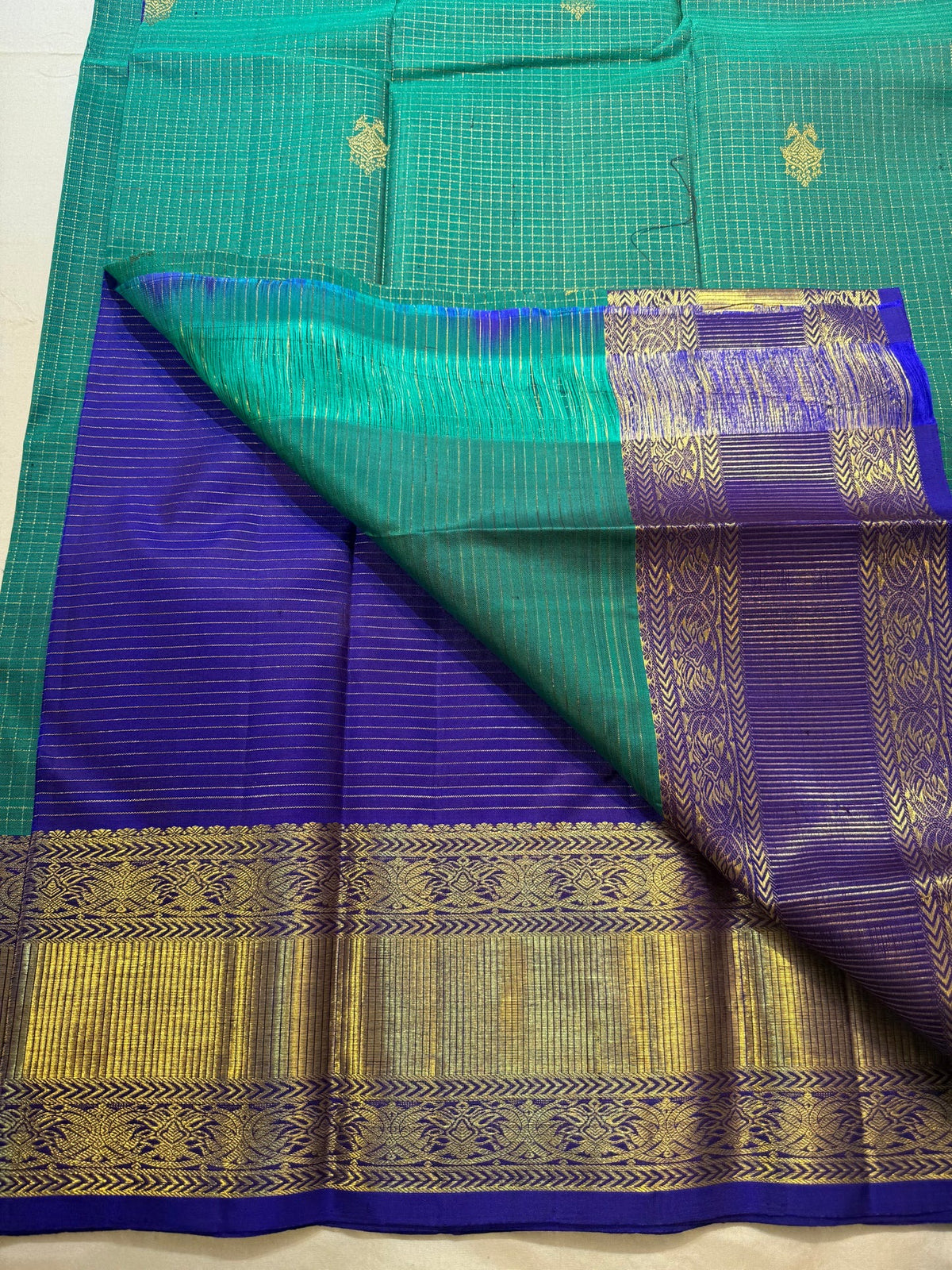 Gandaberunda butta detail on turquoise Kanchipuram silk
