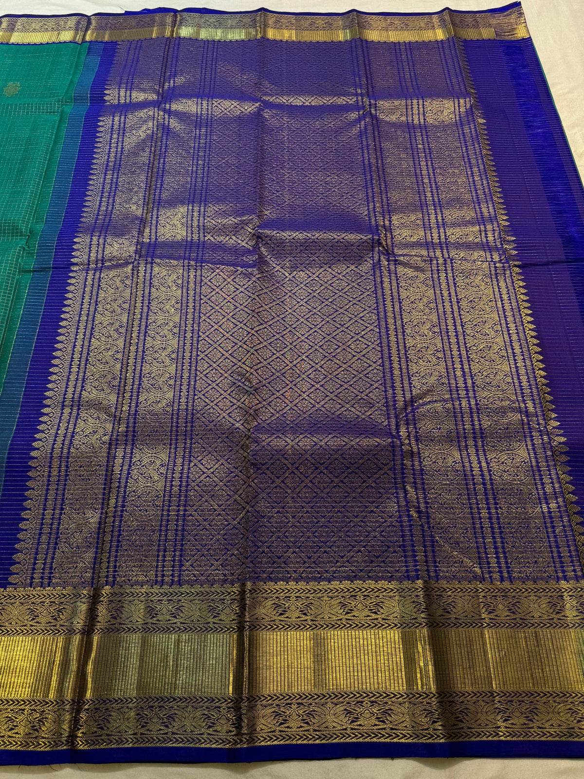 Purple gold zari pallu on turquoise green Kanjivaram